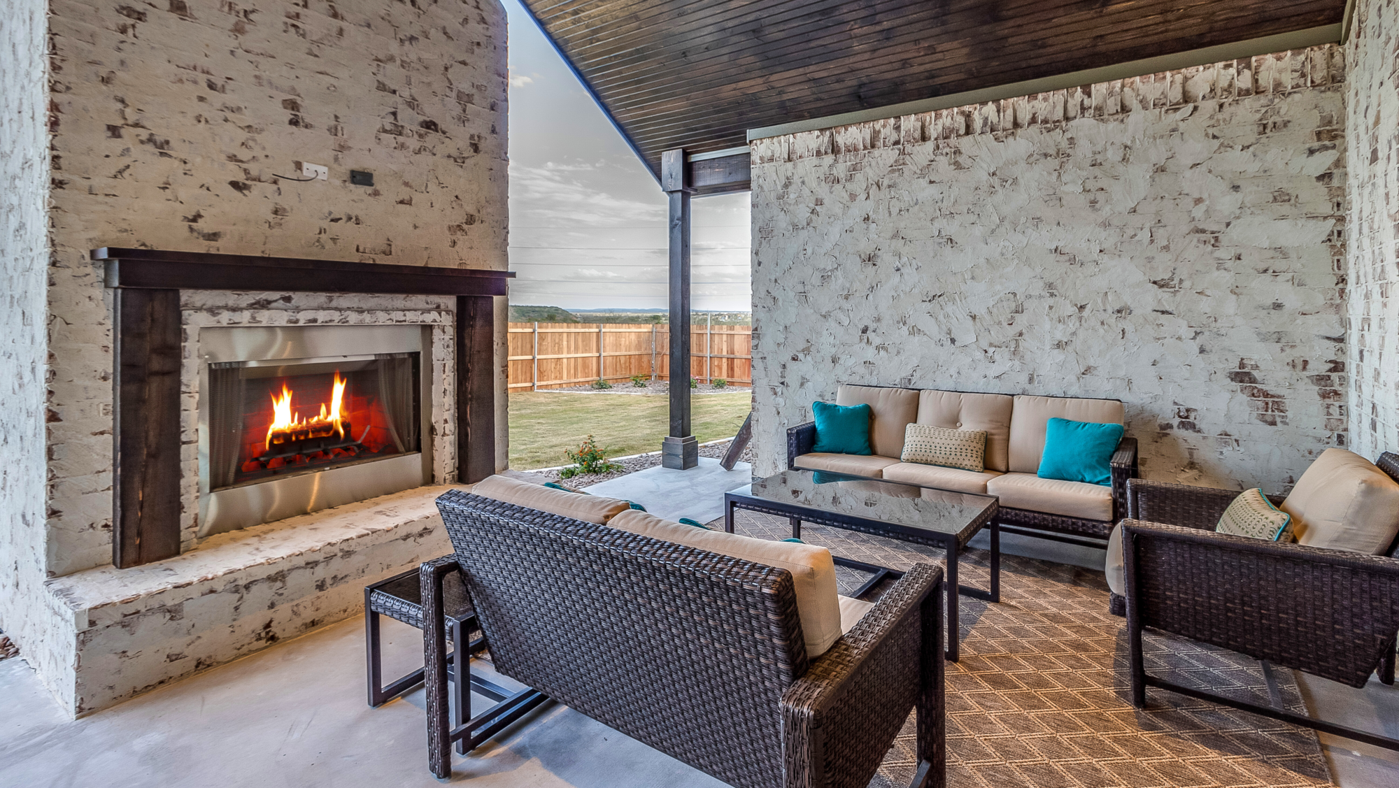 outdoor garden with chairs and fireplace