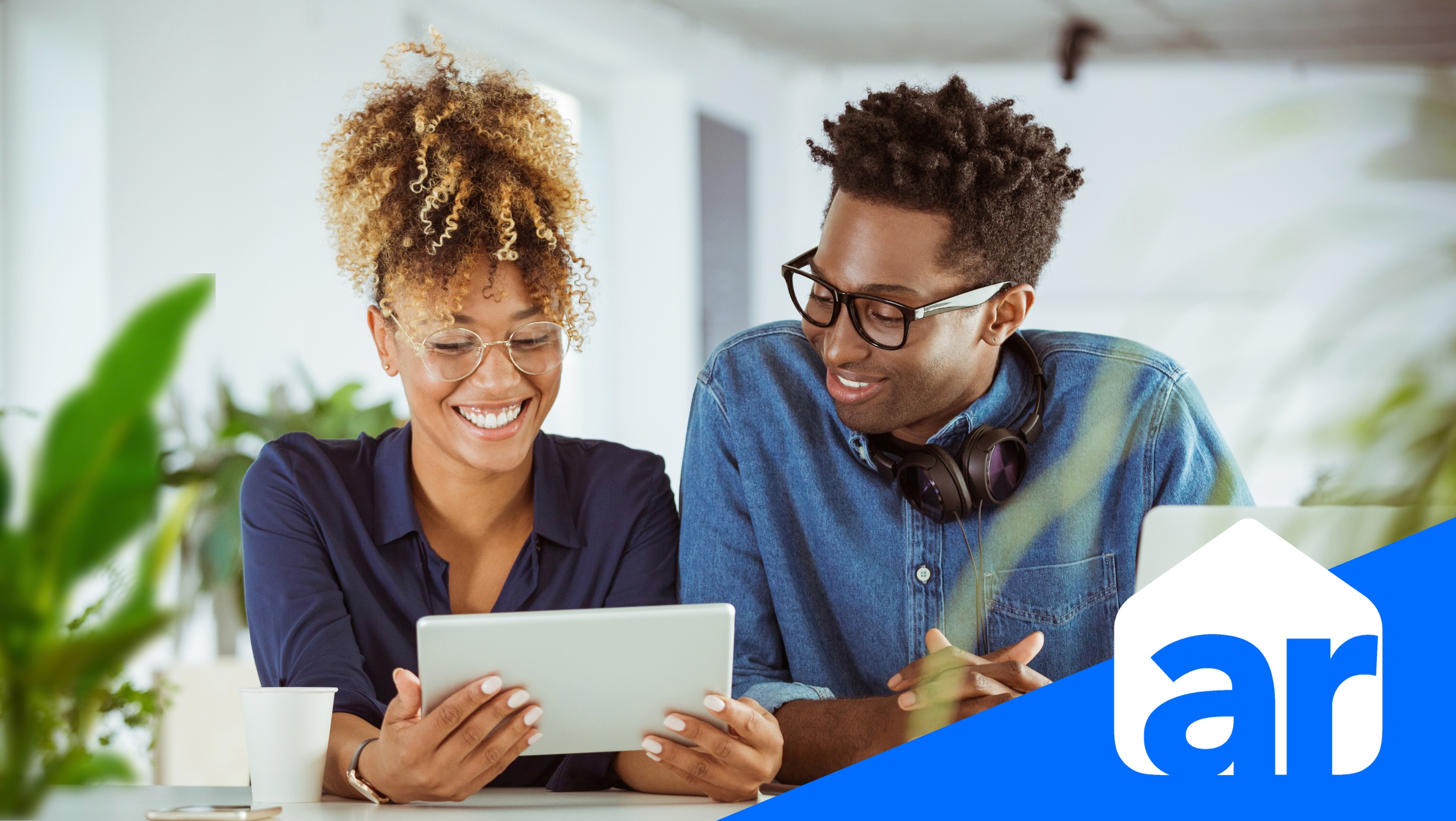 photo otwo people looking at a tablet screen